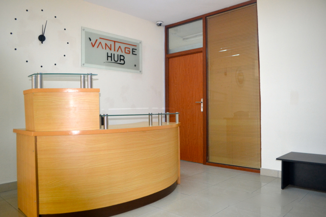 Vantage Hub reception desk with branded signage